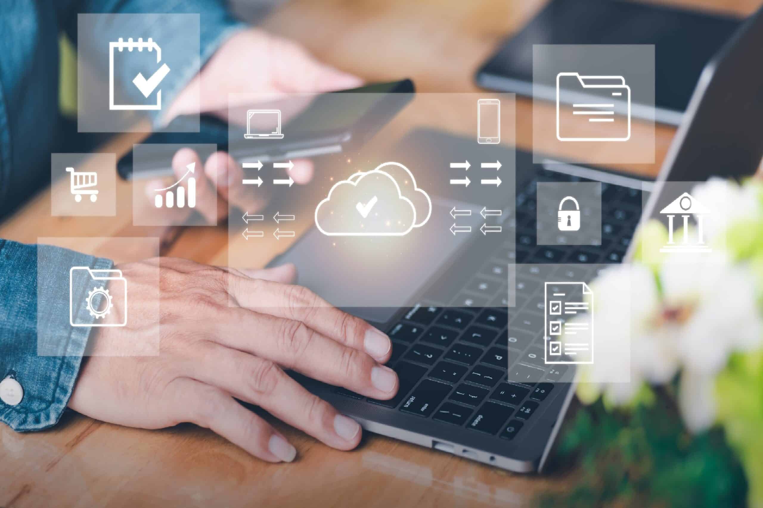 Image of hand accessing cloud services on laptop