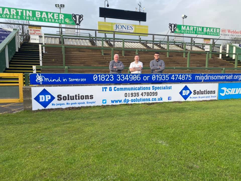 DPS Team Standing Behind YTFC Board
